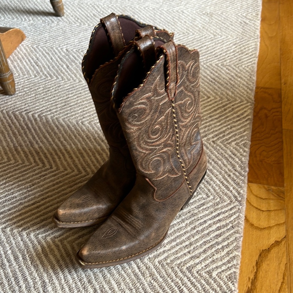 One pair of Durango women’s 11 inch western brown boots. Size 9 med.